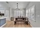 Charming dining area with wooden table and bench, located near the kitchen at 11225 Scotchwood Dr, Riverview, FL 33579