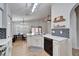 Open kitchen boasts white cabinets, quartz countertops and stainless steel appliances at 11225 Scotchwood Dr, Riverview, FL 33579
