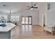 Open floor plan features kitchen island and french doors to backyard at 11225 Scotchwood Dr, Riverview, FL 33579
