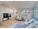 Spacious living room with hardwood floors and a comfortable seating area at 11225 Scotchwood Dr, Riverview, FL 33579