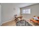 Home office with wood desk and comfy chair at 11225 Scotchwood Dr, Riverview, FL 33579