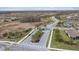 Entrance to community with palm trees and landscaped entryway at 11465 Bitola Dr, Odessa, FL 33556