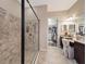 Elegant bathroom with walk-in shower and dual vanity at 11465 Bitola Dr, Odessa, FL 33556