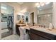 Double vanity, walk-in shower, and access to a large closet at 11465 Bitola Dr, Odessa, FL 33556