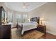 Spacious bedroom with hardwood floors and window seating at 11465 Bitola Dr, Odessa, FL 33556