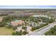 Aerial view of community pool, clubhouse, and tennis courts at 11465 Bitola Dr, Odessa, FL 33556