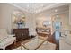 Open dining room with hardwood floors and chandelier at 11465 Bitola Dr, Odessa, FL 33556