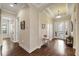 Bright entry hall with hardwood floors and elegant architectural details at 11465 Bitola Dr, Odessa, FL 33556