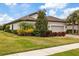 Single-story home with a two-car garage and manicured landscaping at 11465 Bitola Dr, Odessa, FL 33556