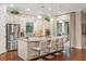 Gourmet kitchen boasts granite countertops, stainless steel appliances, and an island at 11465 Bitola Dr, Odessa, FL 33556