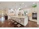 Bright kitchen with white cabinets, granite island, and stainless steel appliances at 11465 Bitola Dr, Odessa, FL 33556