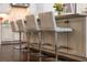 Modern kitchen island with seating for three at 11465 Bitola Dr, Odessa, FL 33556