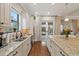 Modern kitchen with double sink and granite countertops at 11465 Bitola Dr, Odessa, FL 33556