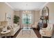 Light-filled living room with a cozy seating arrangement at 11465 Bitola Dr, Odessa, FL 33556