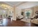 Spacious living room featuring hardwood floors and neutral decor at 11465 Bitola Dr, Odessa, FL 33556