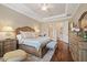Main bedroom with king-size bed, ensuite bathroom access, and walk-in closet at 11465 Bitola Dr, Odessa, FL 33556