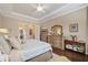 Main bedroom with king-size bed, ensuite bathroom access, and walk-in closet at 11465 Bitola Dr, Odessa, FL 33556