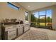 Outdoor kitchen with grill, sink, and ample counter space at 11465 Bitola Dr, Odessa, FL 33556