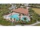 Resort-style pool with lounge chairs and surrounding landscaping at 11465 Bitola Dr, Odessa, FL 33556