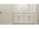 Bathroom with double vanity and white cabinets at 12422 Sweet Angel Aura Way, Parrish, FL 34219