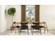 Light and airy dining room with a table and six chairs, near a window at 12422 Sweet Angel Aura Way, Parrish, FL 34219