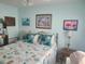 Bedroom with coastal decor and a comfortable bed at 1279 Dinnerbell E Ln, Dunedin, FL 34698