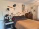 Bedroom with double bed, dresser, and sports memorabilia at 1279 Dinnerbell E Ln, Dunedin, FL 34698