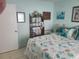 Bedroom with built-in shelving and coastal decor at 1279 Dinnerbell E Ln, Dunedin, FL 34698
