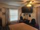 Bedroom with a double bed, TV, and vanity area at 1279 Dinnerbell E Ln, Dunedin, FL 34698