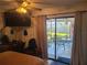 Bedroom with patio access and comfortable seating at 1279 Dinnerbell E Ln, Dunedin, FL 34698