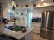 Modern kitchen with stainless steel appliances and ample counter space at 1279 Dinnerbell E Ln, Dunedin, FL 34698