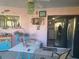Relaxing patio with table, chairs, and a view of the interior at 1279 Dinnerbell E Ln, Dunedin, FL 34698