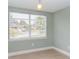 Small bedroom with light walls, window, and vinyl plank flooring at 1341 Springdale St, Clearwater, FL 33755