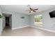 Light gray bedroom with ceiling fan and wood-look floors at 1341 Springdale St, Clearwater, FL 33755