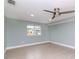 Bright bedroom featuring light grey walls, a window, and vinyl plank flooring at 1341 Springdale St, Clearwater, FL 33755