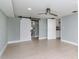 Spacious bedroom with light grey walls, ceiling fan, and vinyl plank flooring at 1341 Springdale St, Clearwater, FL 33755