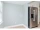 Simple dining area with a stainless steel refrigerator and a view of a window at 1341 Springdale St, Clearwater, FL 33755