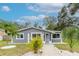 Newly renovated gray house with walkway and tropical landscaping at 1341 Springdale St, Clearwater, FL 33755