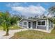 Refreshed gray house exterior, walkway, and lush landscaping at 1341 Springdale St, Clearwater, FL 33755