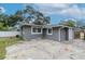 Gray house exterior with a large backyard at 1341 Springdale St, Clearwater, FL 33755