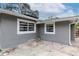 Gray house exterior with a spacious backyard at 1341 Springdale St, Clearwater, FL 33755