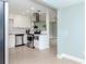 Modern kitchen features white cabinets, stainless steel appliances, and granite countertops at 1341 Springdale St, Clearwater, FL 33755