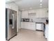 Bright kitchen with white shaker cabinets, stainless steel appliances, and light wood floors at 1341 Springdale St, Clearwater, FL 33755