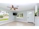 Living room with light gray walls, ceiling fan, and wood-look floors at 1341 Springdale St, Clearwater, FL 33755