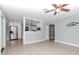 Open concept living room with kitchen and wood-look floors at 1341 Springdale St, Clearwater, FL 33755