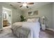 Bright bedroom with ensuite bathroom access and modern decor at 13819 Pathfinder Dr, Tampa, FL 33625