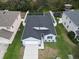 One-story house with gray roof, two-car garage, and fenced yard at 15415 Trinity Fall Way, Bradenton, FL 34212