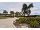 Community center with palm trees and landscaped entrance at 15415 Trinity Fall Way, Bradenton, FL 34212