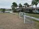 Community soccer field with goal and bench near pond at 15415 Trinity Fall Way, Bradenton, FL 34212