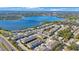 Aerial view of waterfront community with lush landscaping at 1608 Sunset Wind Loop, Oldsmar, FL 34677